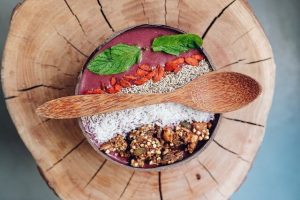 Goji berry smoothie bowl with a wooden spoon