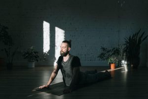 A man doing yoga in a relaxing atmosphere