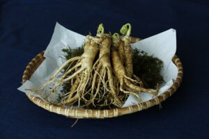 Korean ginseng roots on a plate with powder